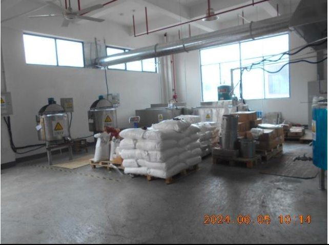 Source photograph of production equipment in the Xiamen home-fragrance facility